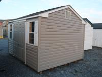 Pine Creek 10x12 HD Peak with Pebble Clay walls, White trim and White Raised Panel shutters, and Weatherwood shingles