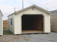 Pine Creek 14x24 Peak Garage with Classic Sand walls, Clay trim and Green Raised Panel shutters, and Shakewood shingles