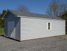 14x28 Front Entry Peak Storage Shed with Harbor Stone Grey Vinyl Siding, White Trim, White Shutters, and a Shingle Roof