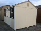 Pine Creek 10x12 HD Peak with Navajo White walls, White trim and Black Z-Style shutters, and Rustic Black shingles